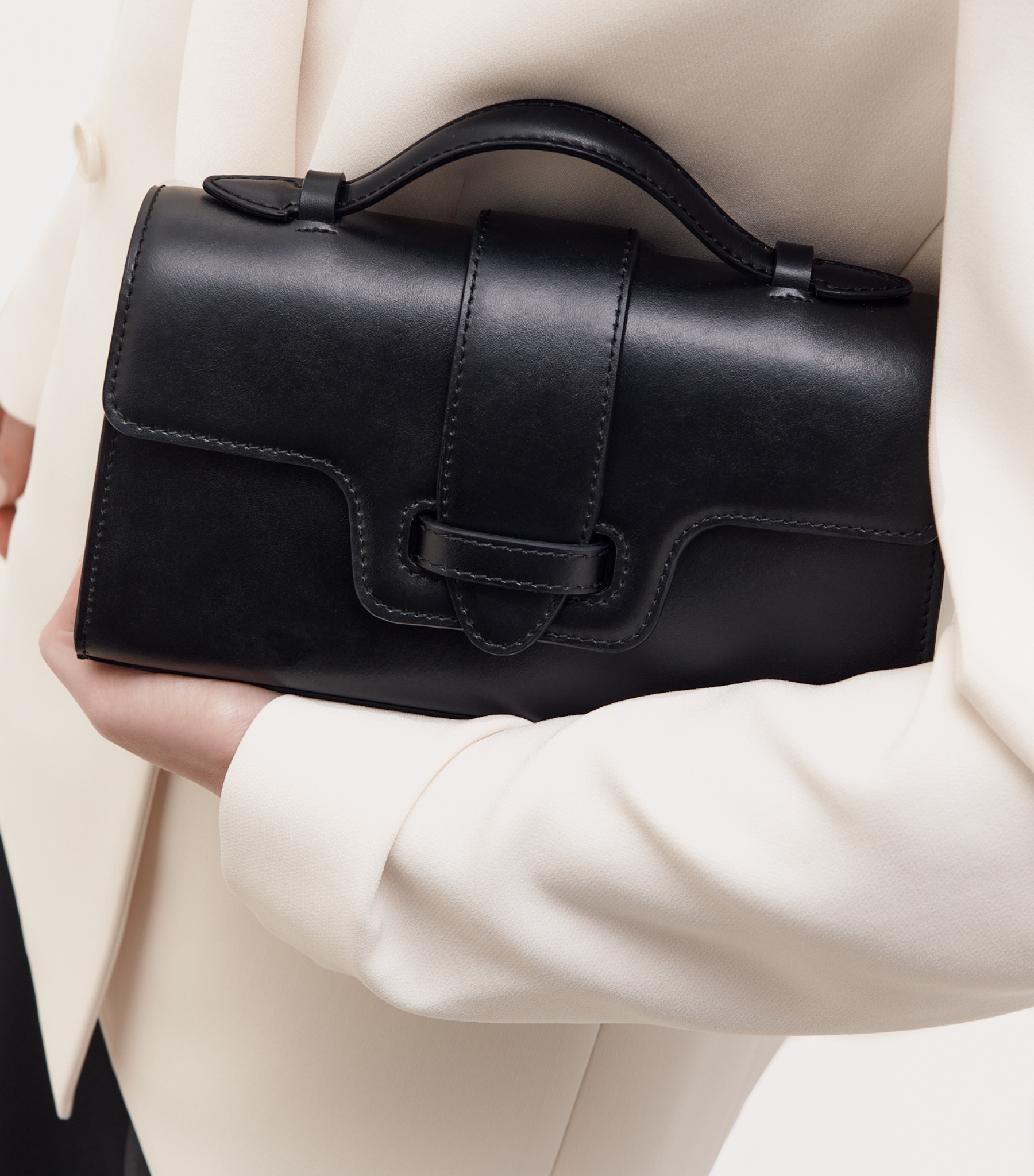 Plant Based Vegan Luxury Sustainable Handbag Made in Spain Ubrique Ethical plant-based leather vegan leather savette symmetry pochette clutch top handle