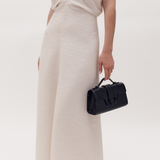 MIRUM bag luxury vegan bags best sustainable handbags savette pochette symmetry pochette savette pochette kelly pochette top handle bag 2025 it bags Stella mccartney ryderbag themoire the moire ethical luxury Spanish handbag brands Spanish bags black mini bag clutch black bag black bags small black bag clutch
