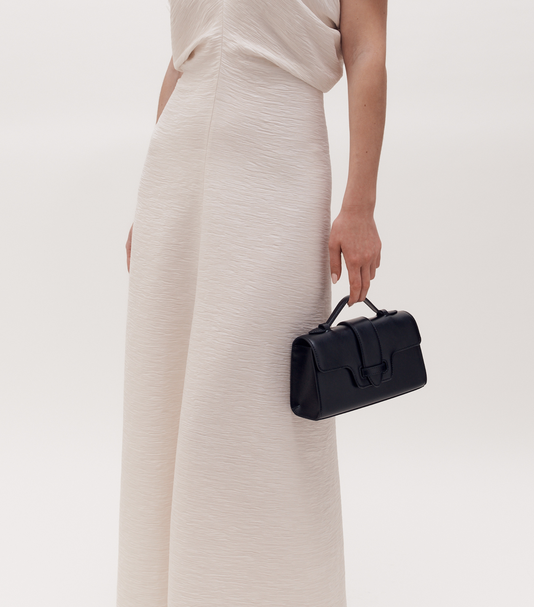 MIRUM bag luxury vegan bags best sustainable handbags savette pochette symmetry pochette savette pochette kelly pochette top handle bag 2025 it bags Stella mccartney ryderbag themoire the moire ethical luxury Spanish handbag brands Spanish bags black mini bag clutch black bag black bags small black bag clutch
