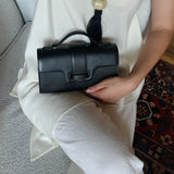 MIRUM bags luxury vegan bags best sustainable handbags savette pochette symmetry pochette savette pochette kelly pochette top handle bag 2025 it bags Stella mccartney ryderbag themoire the moire ethical luxury Spanish handbag brands Spanish bags black mini bag clutch black bag black bags small black bag