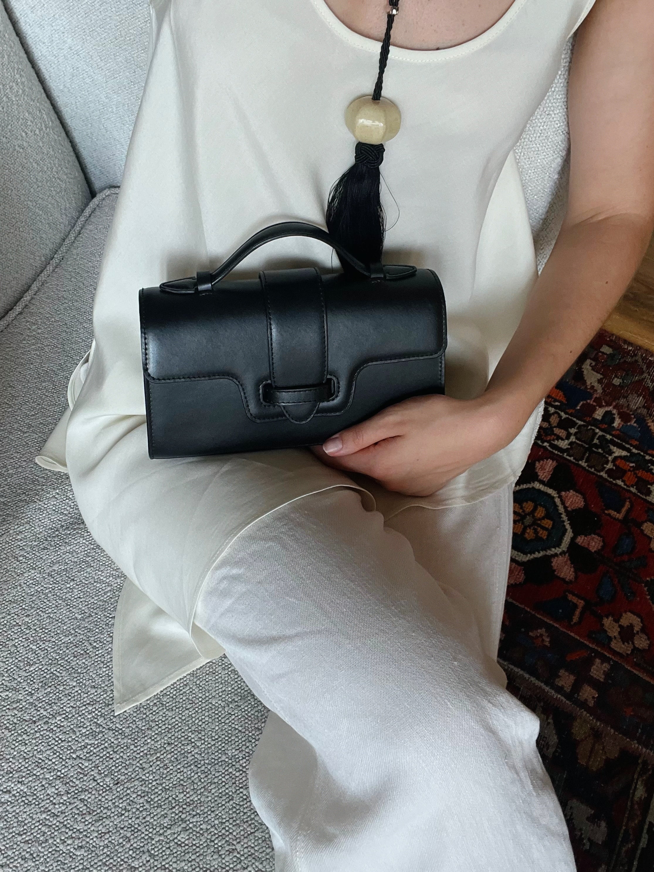 MIRUM bags luxury vegan bags best sustainable handbags savette pochette symmetry pochette savette pochette kelly pochette top handle bag 2025 it bags Stella mccartney ryderbag themoire the moire ethical luxury Spanish handbag brands Spanish bags black mini bag clutch black bag black bags small black bag